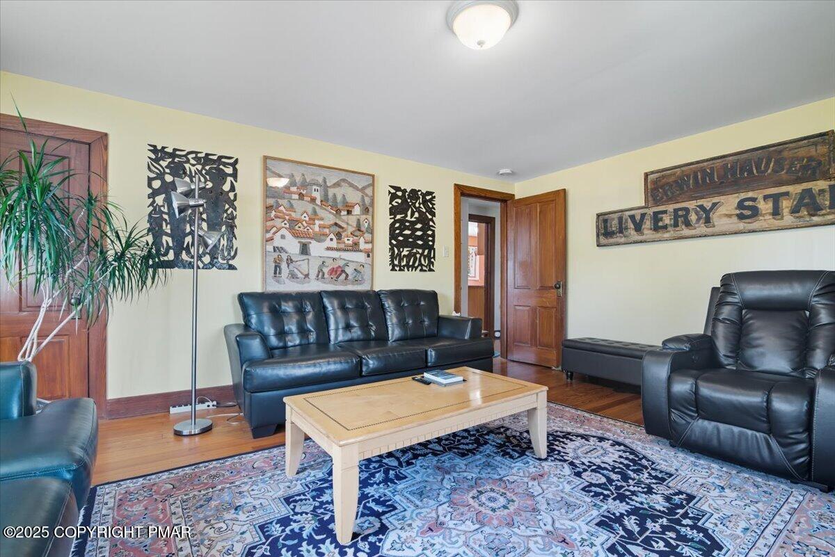 221 Upper Swiftwater Road Mount Pocono, PA 18344 - Photo 48 of 86 a living room with furniture and a potted plant