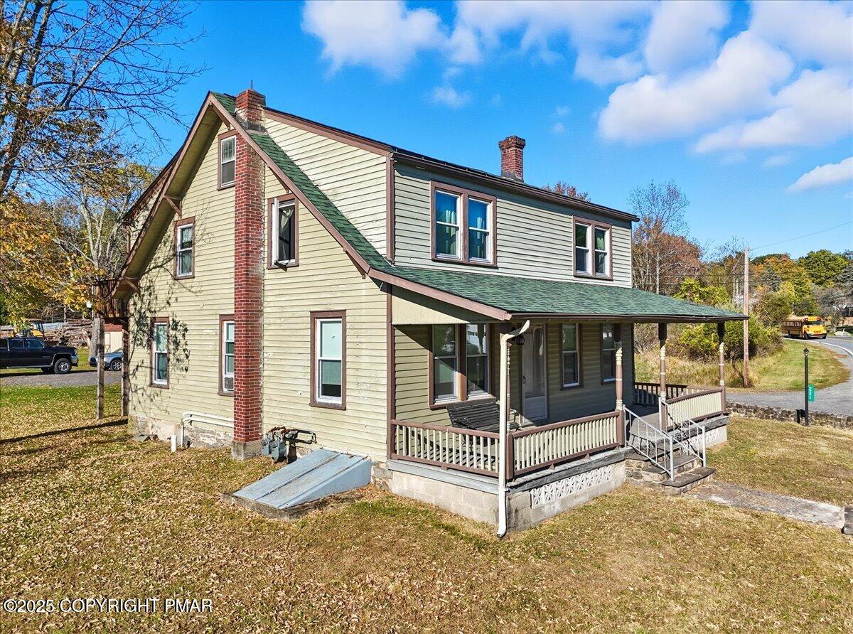 221 Upper Swiftwater Road Mount Pocono, PA 18344 - Photo 5 of 86 a front view of a house with a yard