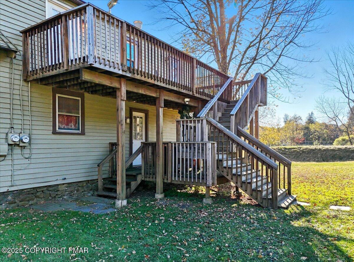221 Upper Swiftwater Road Mount Pocono, PA 18344 - Photo 69 of 86 a view of a house with a small yard and a large tree