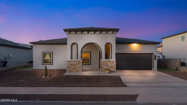 a front view of a house with yard