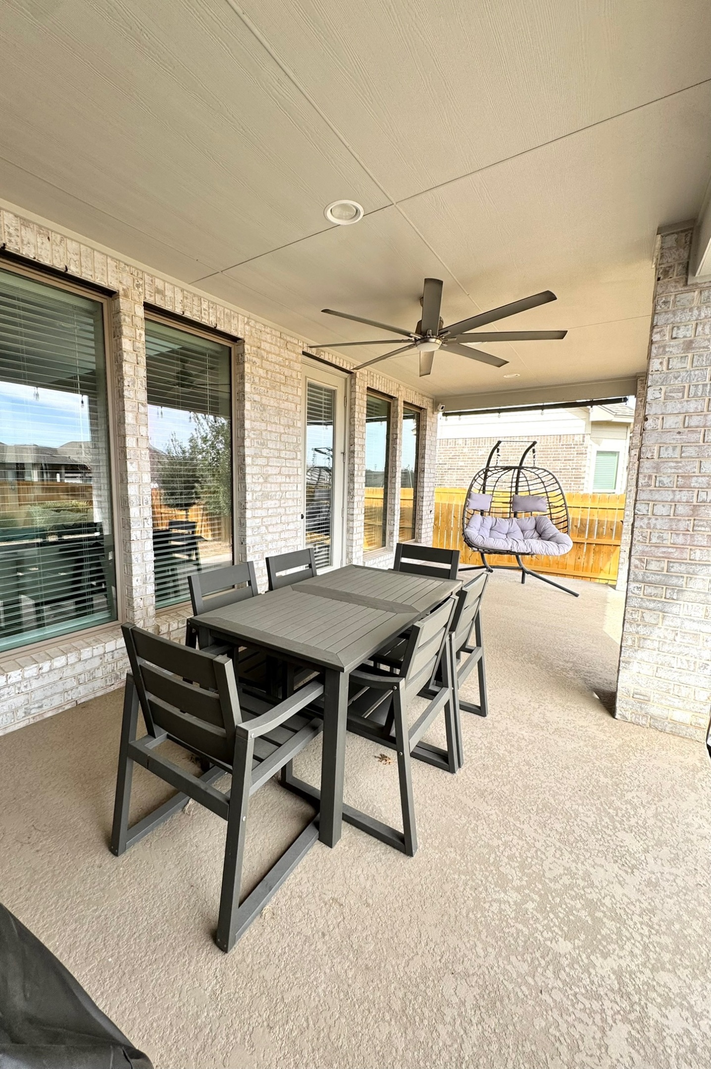 561 Cold Riv Run Kyle, TX 78640 - Photo 23 of 33 a dining room with furniture and a floor to ceiling window