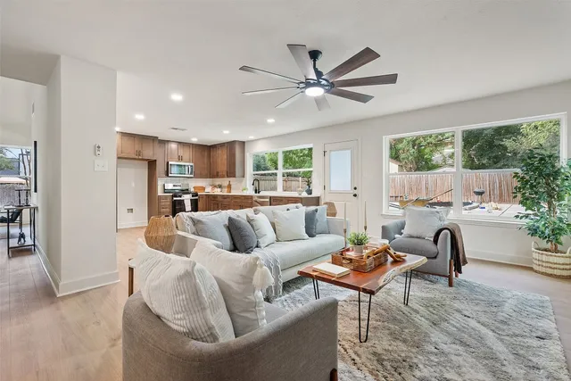 a living room with furniture and a large window