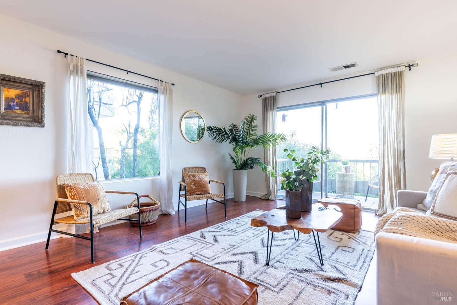 102 Lower Anchorage Road Sausalito, CA 94965 - Photo 1 of 1 a living room with furniture and a window