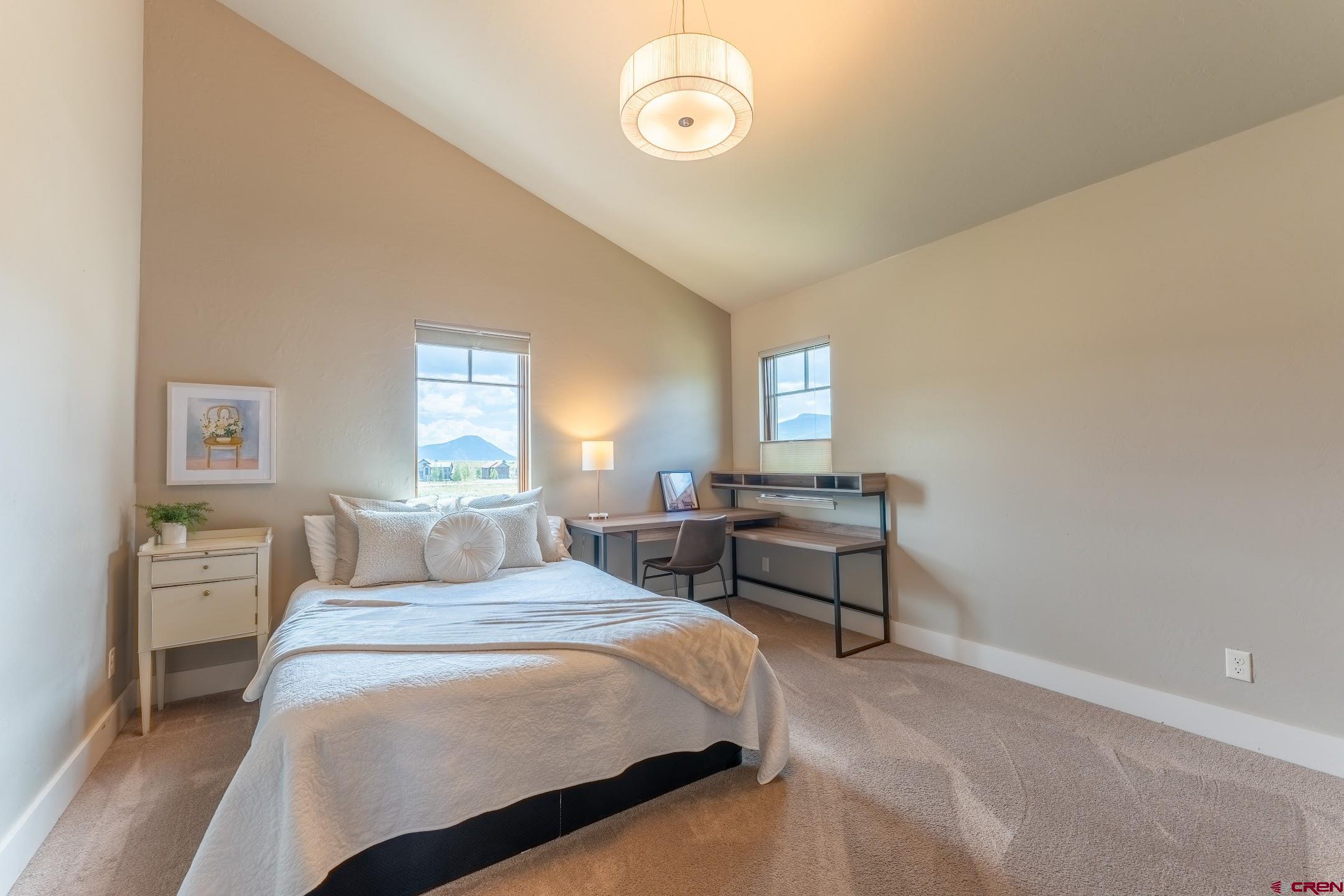 142 Larkspur Loop Crested Butte, CO 81224 - Photo 14 of 35 a bedroom with a bed and a window