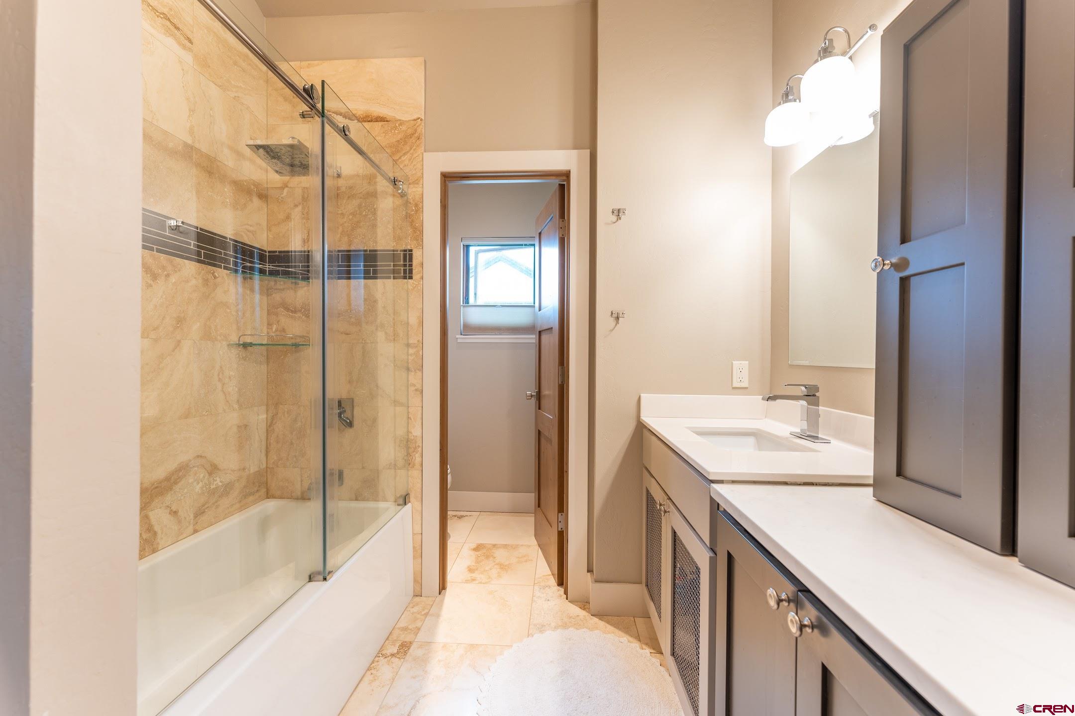 142 Larkspur Loop Crested Butte, CO 81224 - Photo 15 of 35 a bathroom with a double vanity sink and a mirror