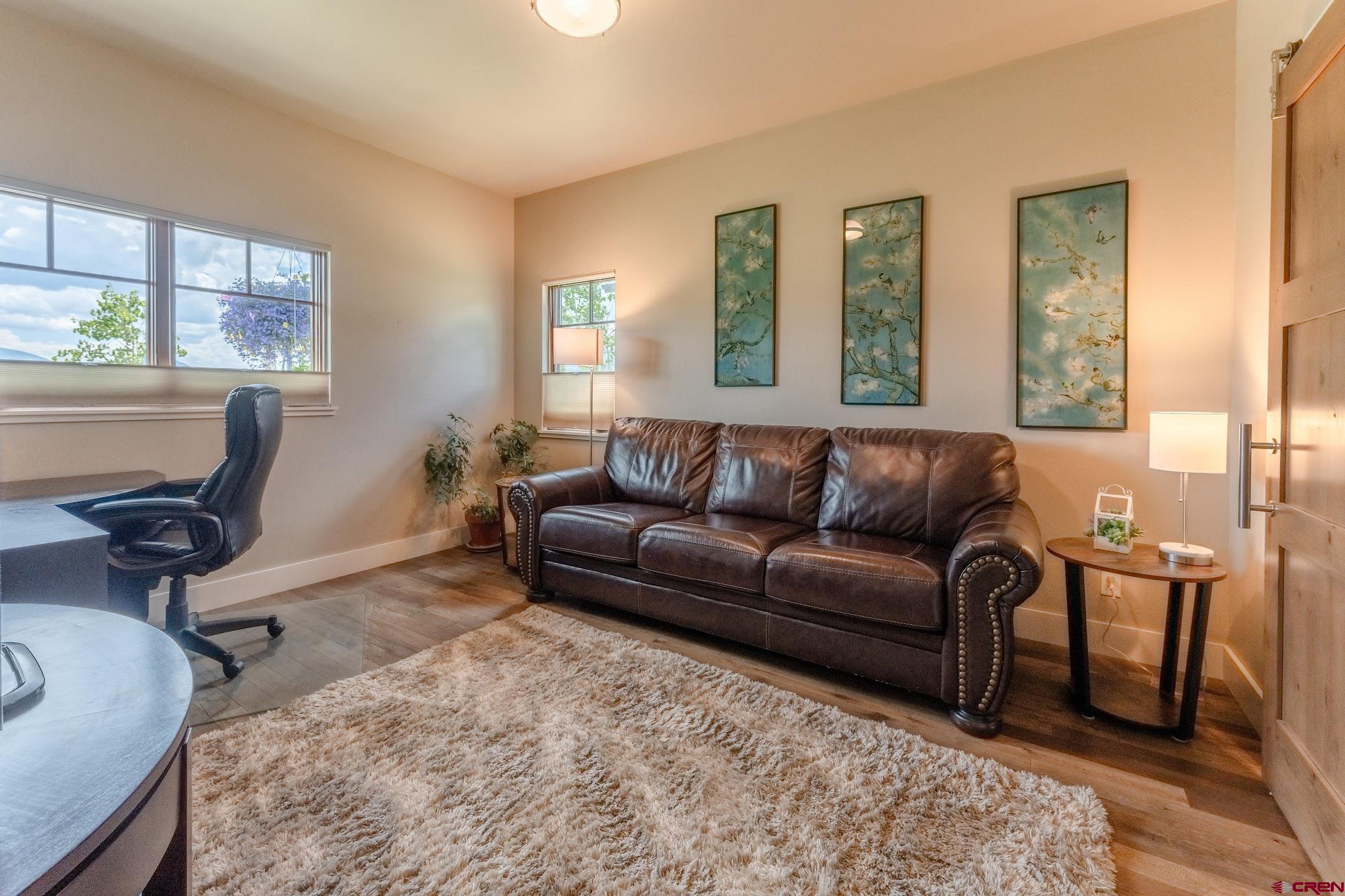 142 Larkspur Loop Crested Butte, CO 81224 - Photo 19 of 35 a living room with furniture and a window