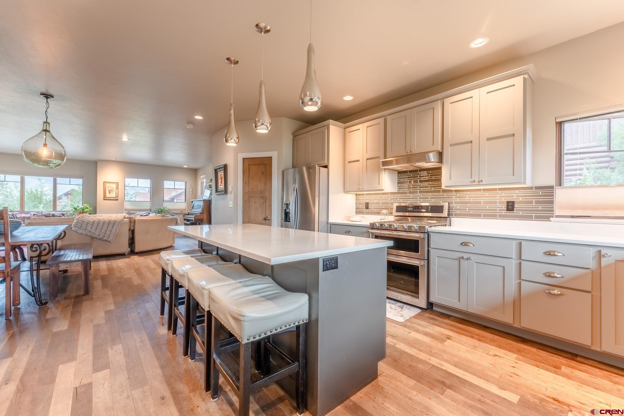 142 Larkspur Loop Crested Butte, CO 81224 - Photo 22 of 35 a large kitchen with kitchen island a large island in it