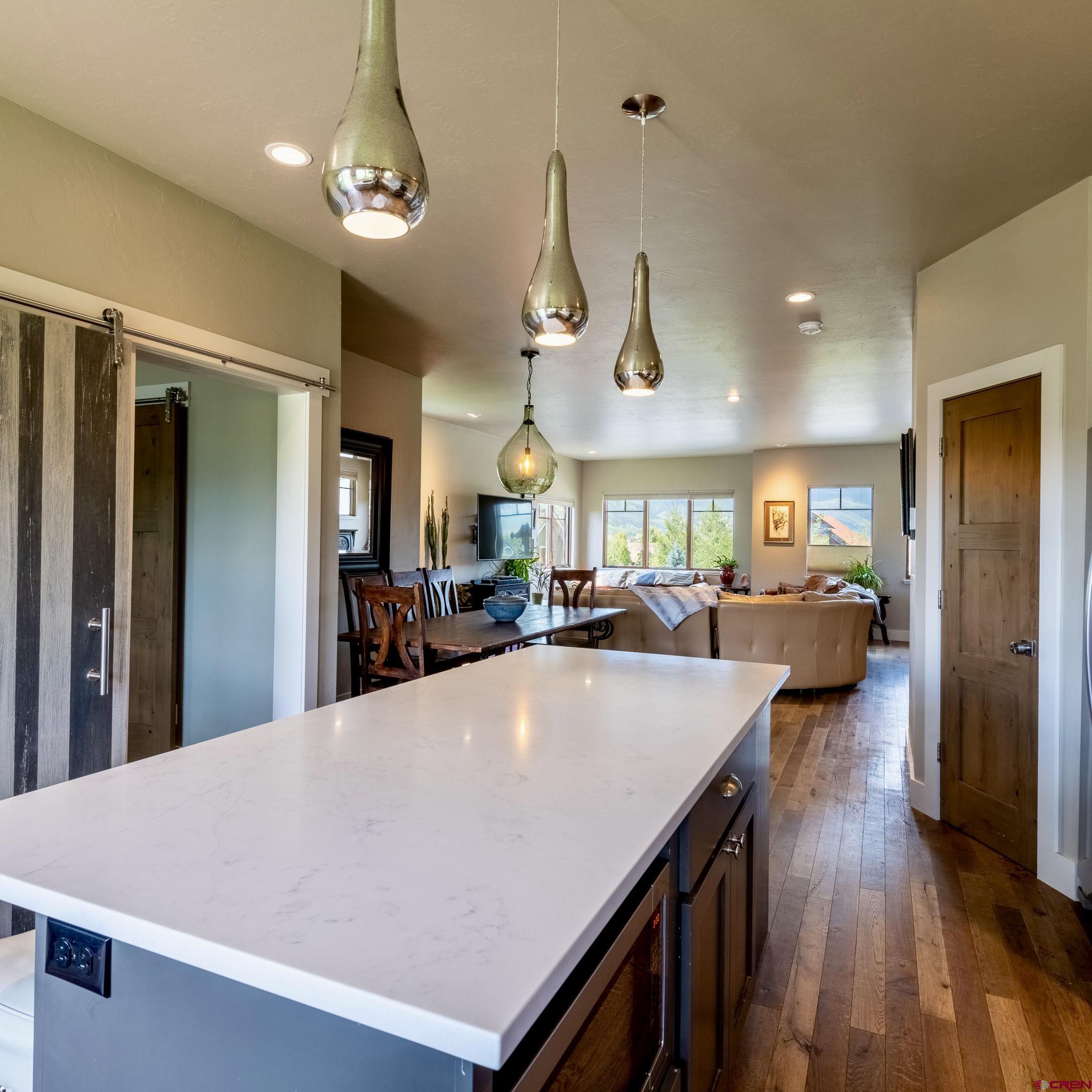 142 Larkspur Loop Crested Butte, CO 81224 - Photo 25 of 35 a large kitchen with lots of counter space and wooden floor