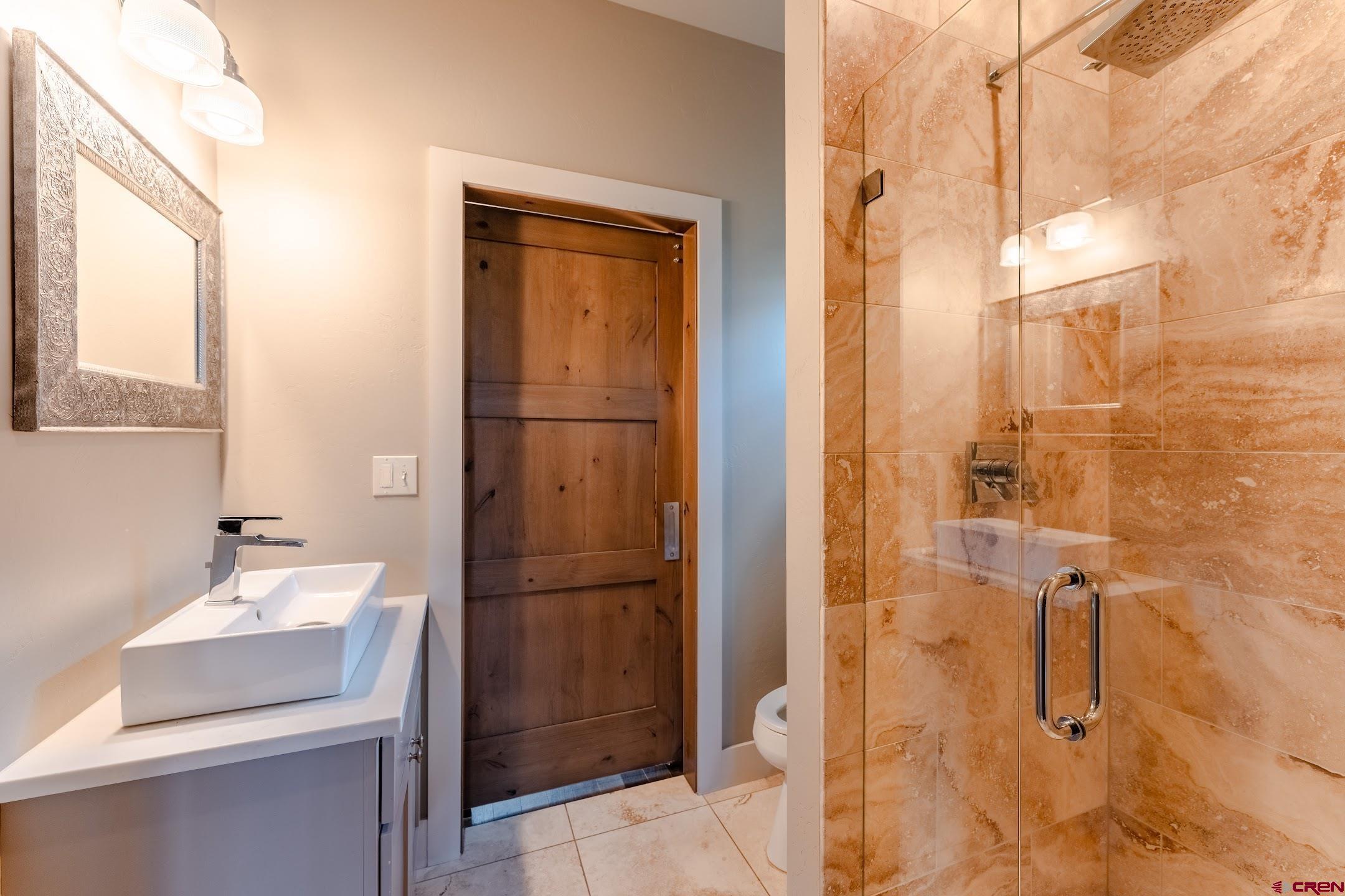 142 Larkspur Loop Crested Butte, CO 81224 - Photo 28 of 35 a bathroom with a sink and mirror