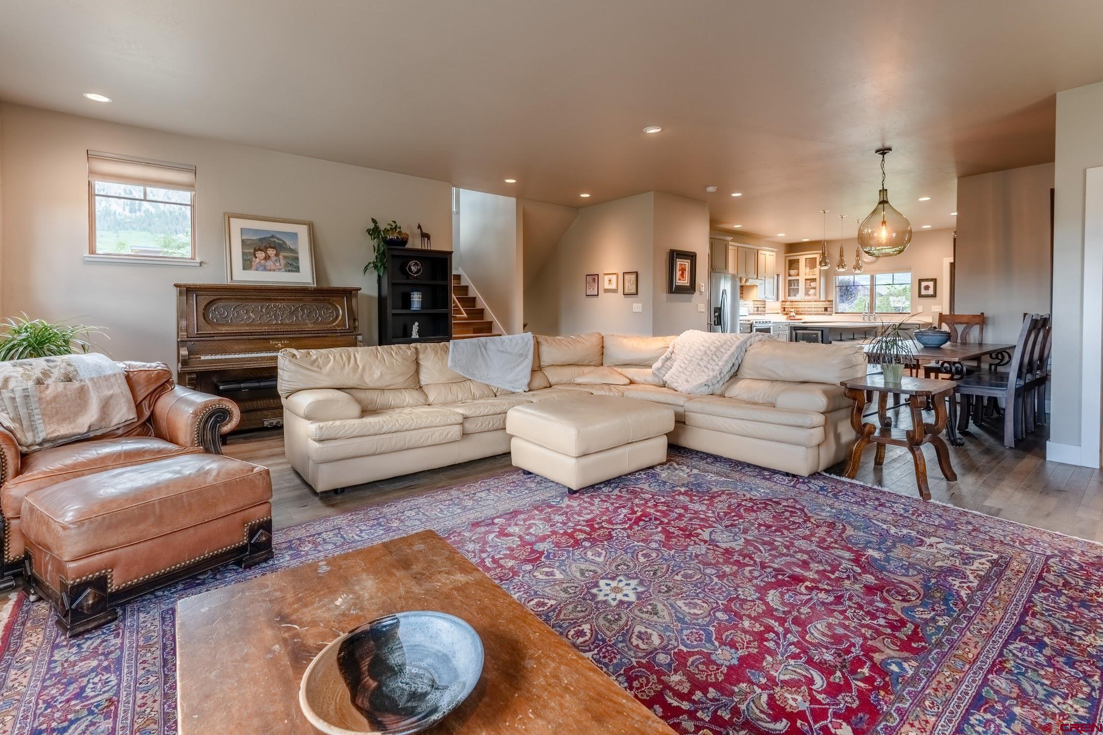142 Larkspur Loop Crested Butte, CO 81224 - Photo 3 of 35 a living room with furniture and a large window