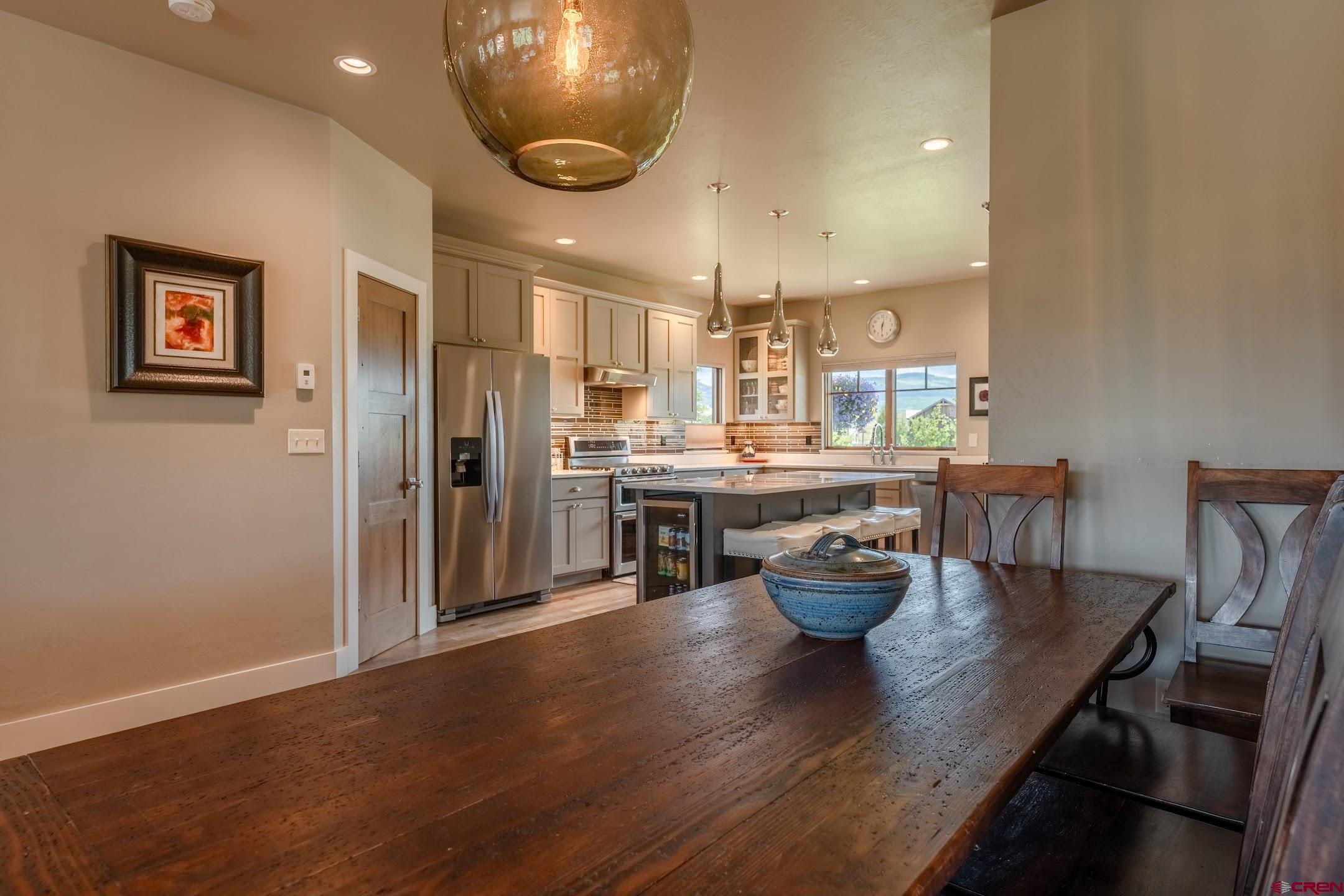 142 Larkspur Loop Crested Butte, CO 81224 - Photo 5 of 35 a kitchen with a table and chairs