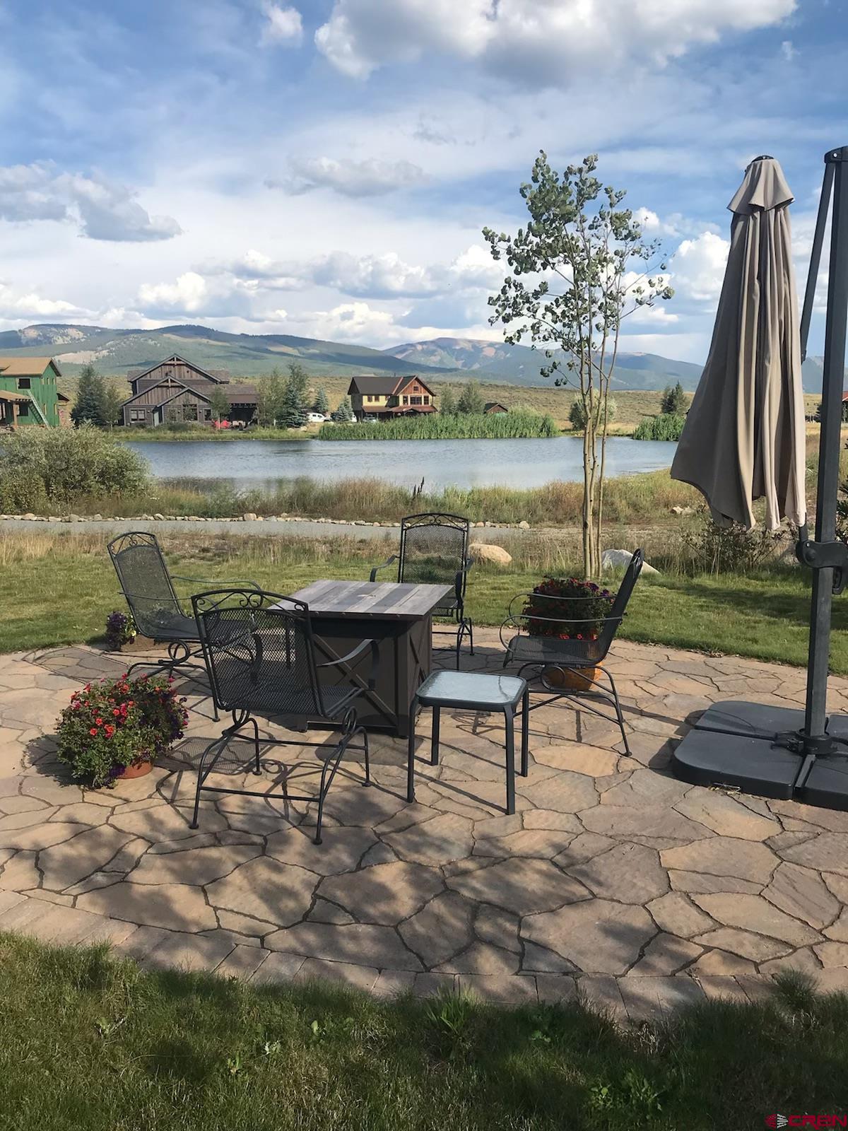 142 Larkspur Loop Crested Butte, CO 81224 - Photo 6 of 35 a view of a lake with outdoor seating