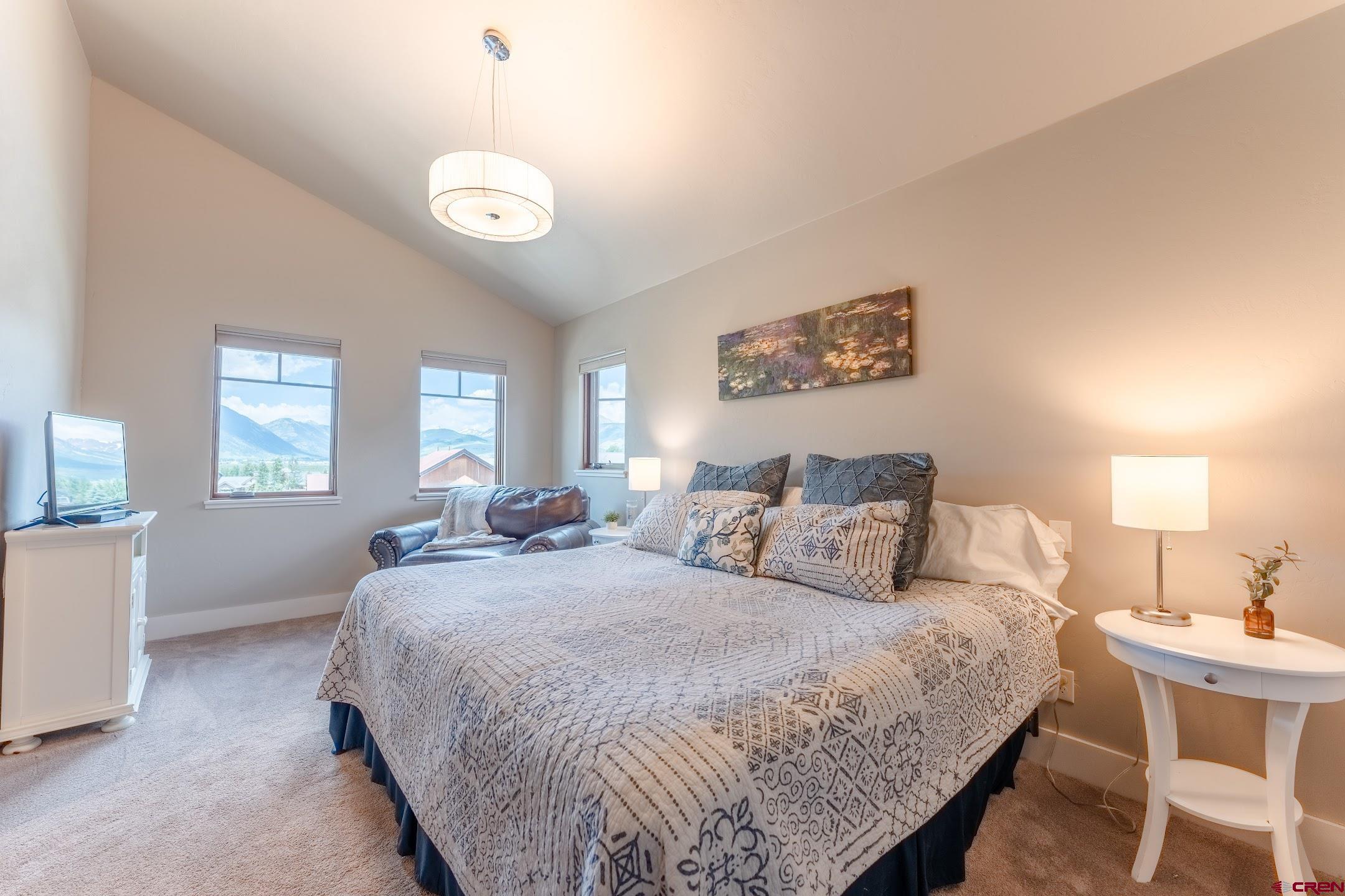 142 Larkspur Loop Crested Butte, CO 81224 - Photo 9 of 35 a bedroom with bed and a window