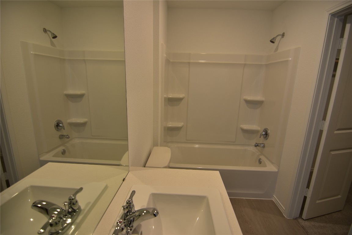 275 Bugbee Kyle, TX 78640 - Photo 30 of 39 a bathroom with a sink and a bathtub