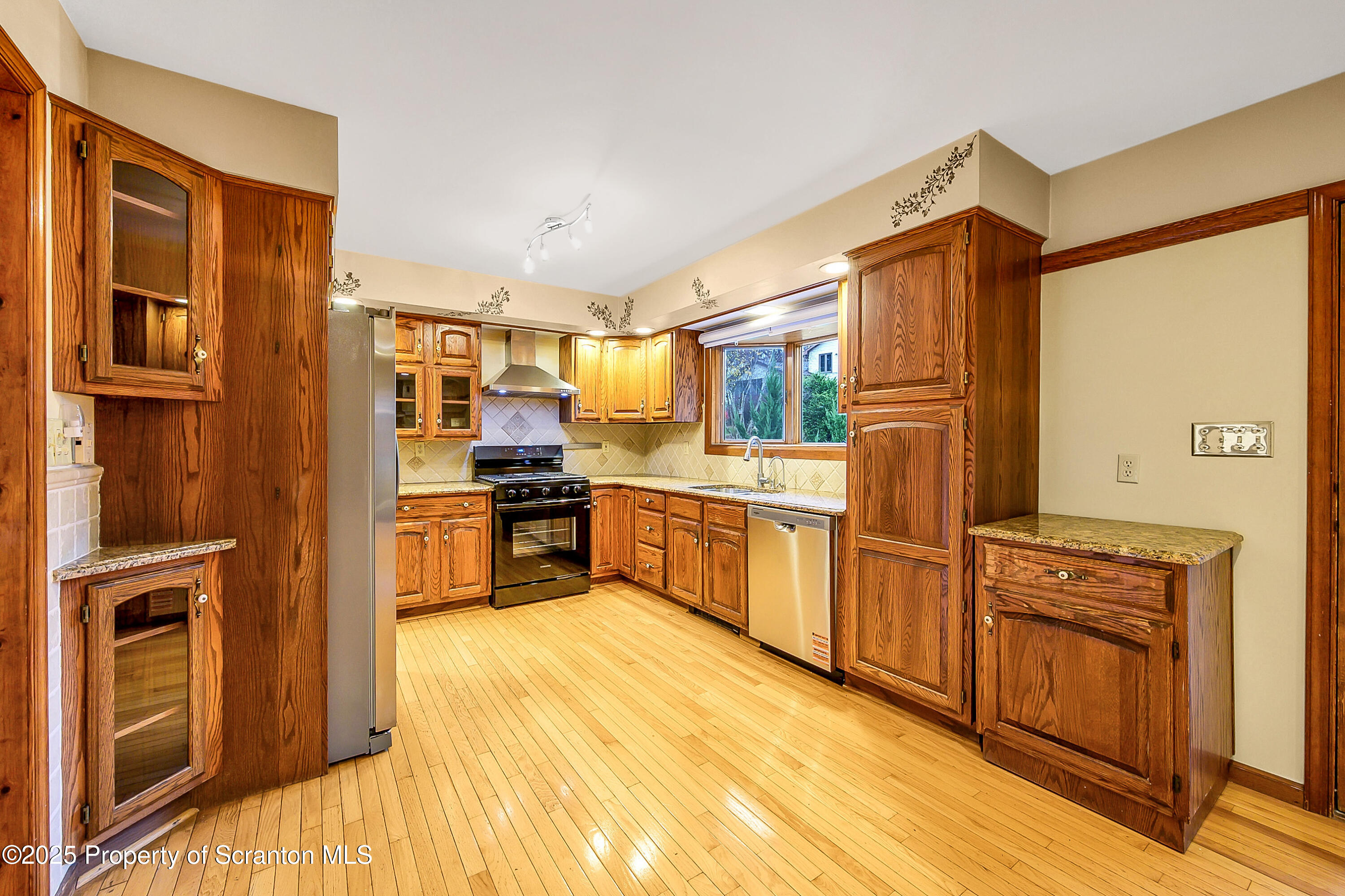 804 Fairview Road Clarks Summit, PA 18411 - Photo 23 of 49 a kitchen with stainless steel appliances a refrigerator and a stove top oven