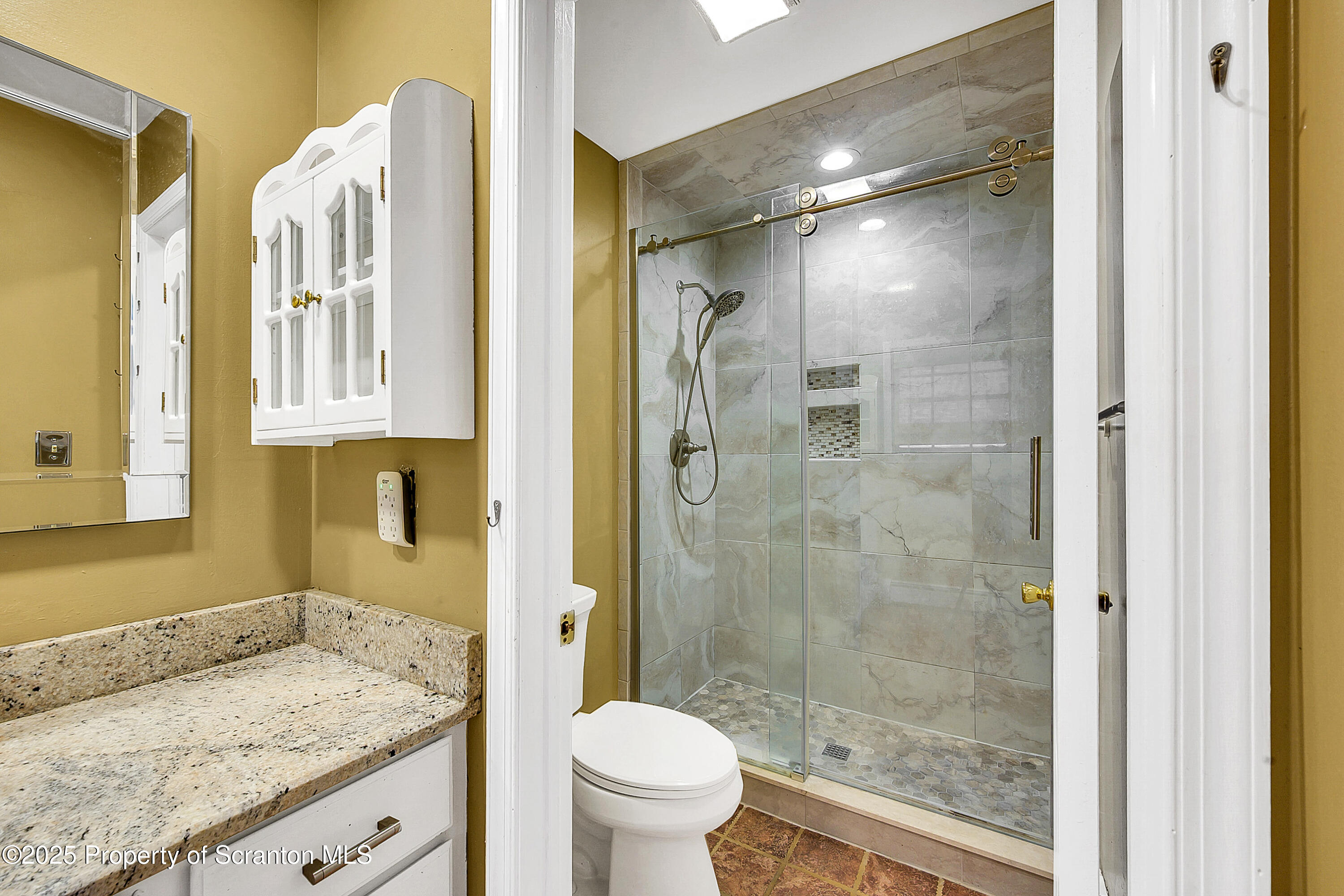 804 Fairview Road Clarks Summit, PA 18411 - Photo 35 of 49 a bathroom with a granite countertop sink toilet and shower