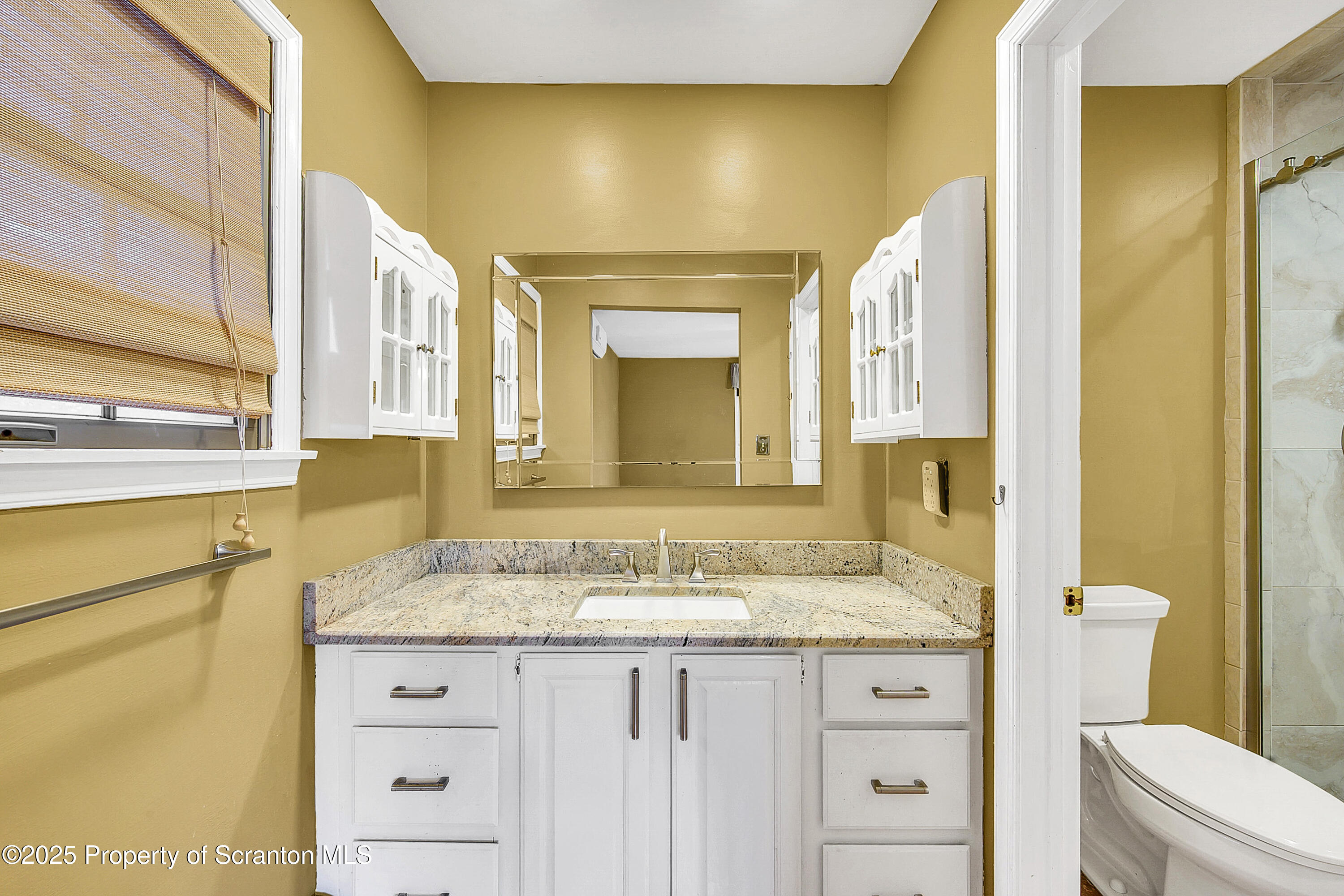 804 Fairview Road Clarks Summit, PA 18411 - Photo 36 of 49 a bathroom with a granite countertop sink mirror vanity and toilet