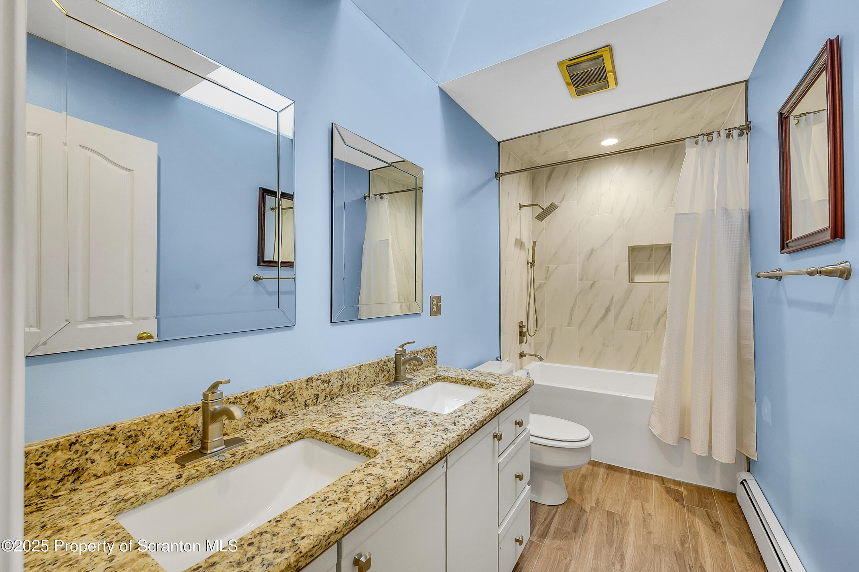804 Fairview Road Clarks Summit, PA 18411 - Photo 41 of 49 a spacious bathroom with a granite countertop sink toilet and shower