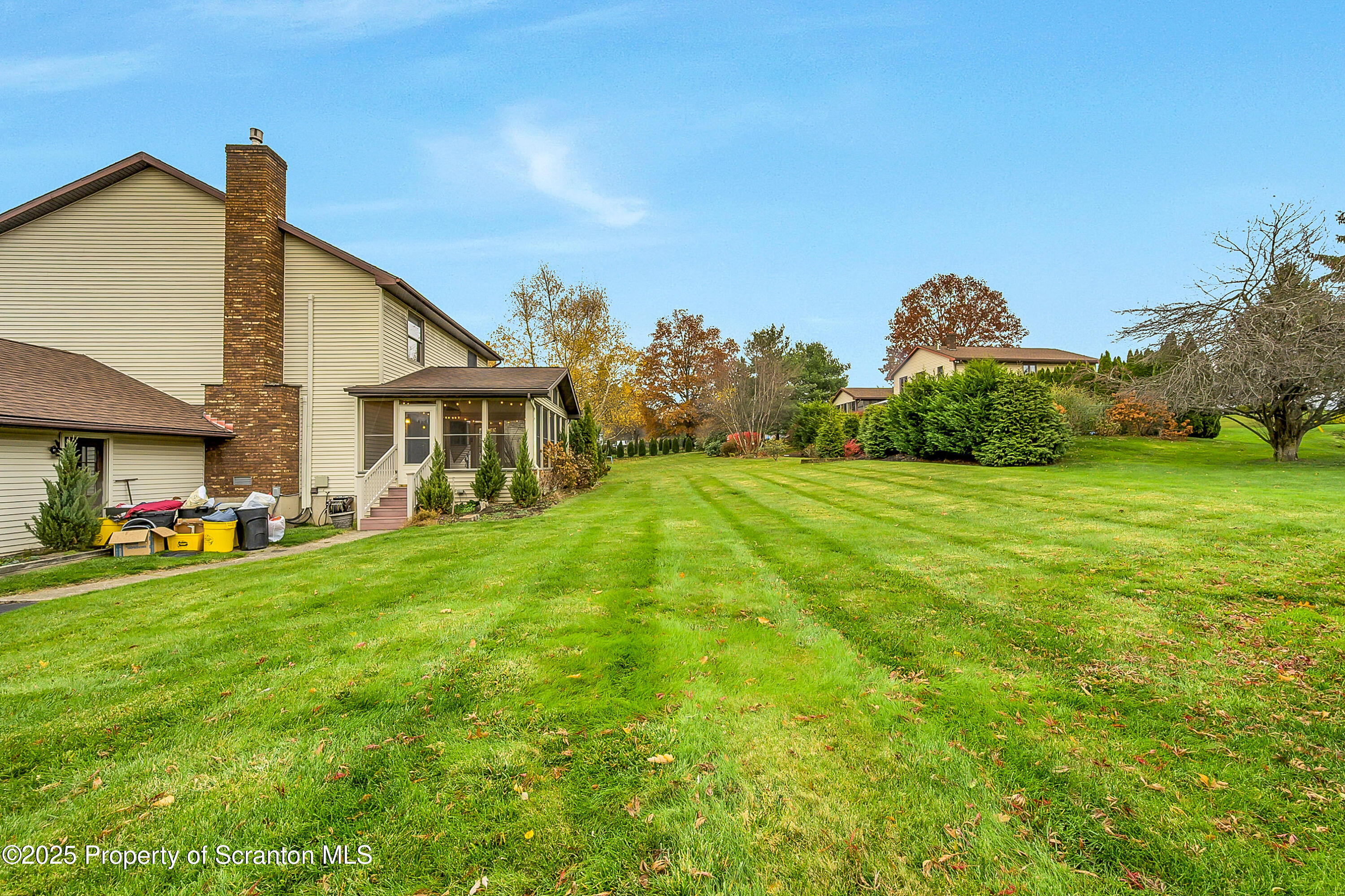 804 Fairview Road Clarks Summit, PA 18411 - Photo 9 of 49 a view of a house with a yard and sitting area