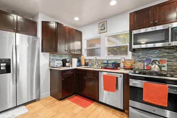 a view of a backyard with sitting area