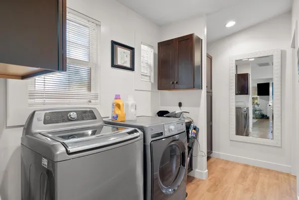 a backyard of a house with table and chairs