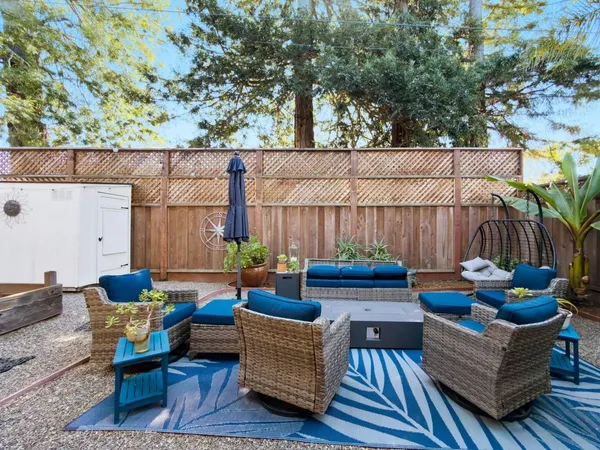 an aerial view of a house with a yard and garden