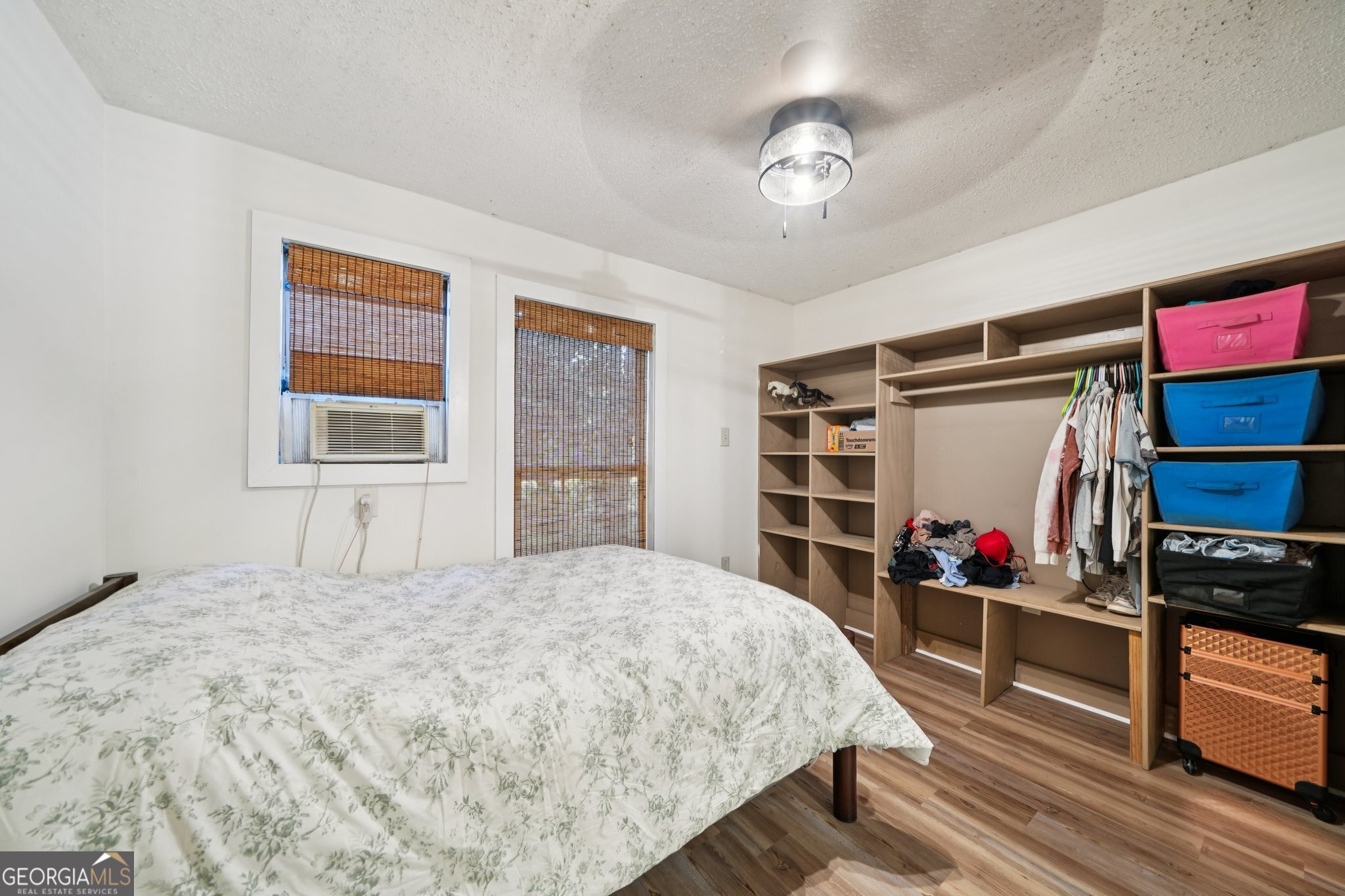 786 Moon Road Waco, GA 30182 - Photo 12 of 53 a bedroom with a bed closet and a window