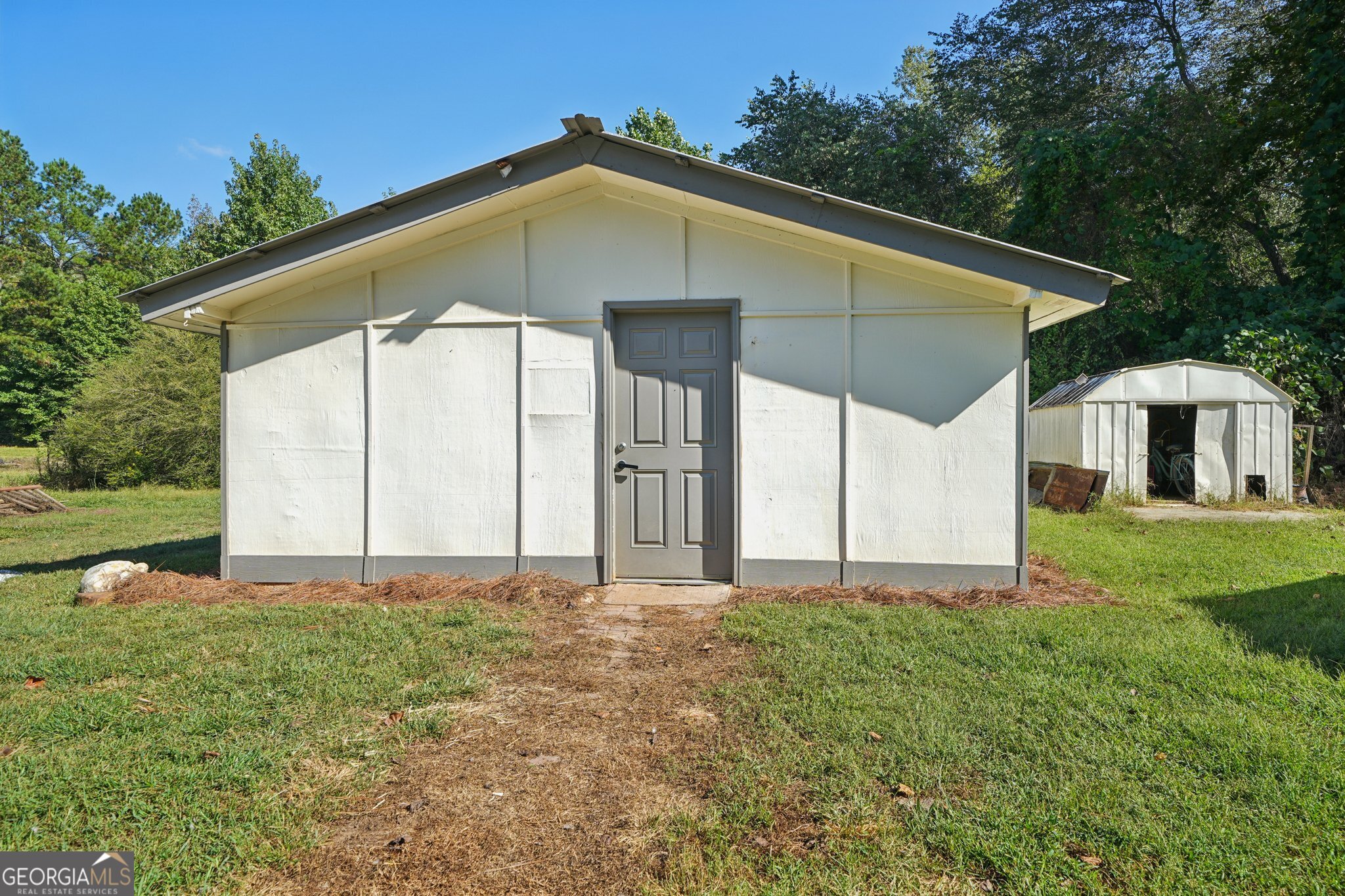 786 Moon Road Waco, GA 30182 - Photo 26 of 53 a house with a small yard and wooden fence
