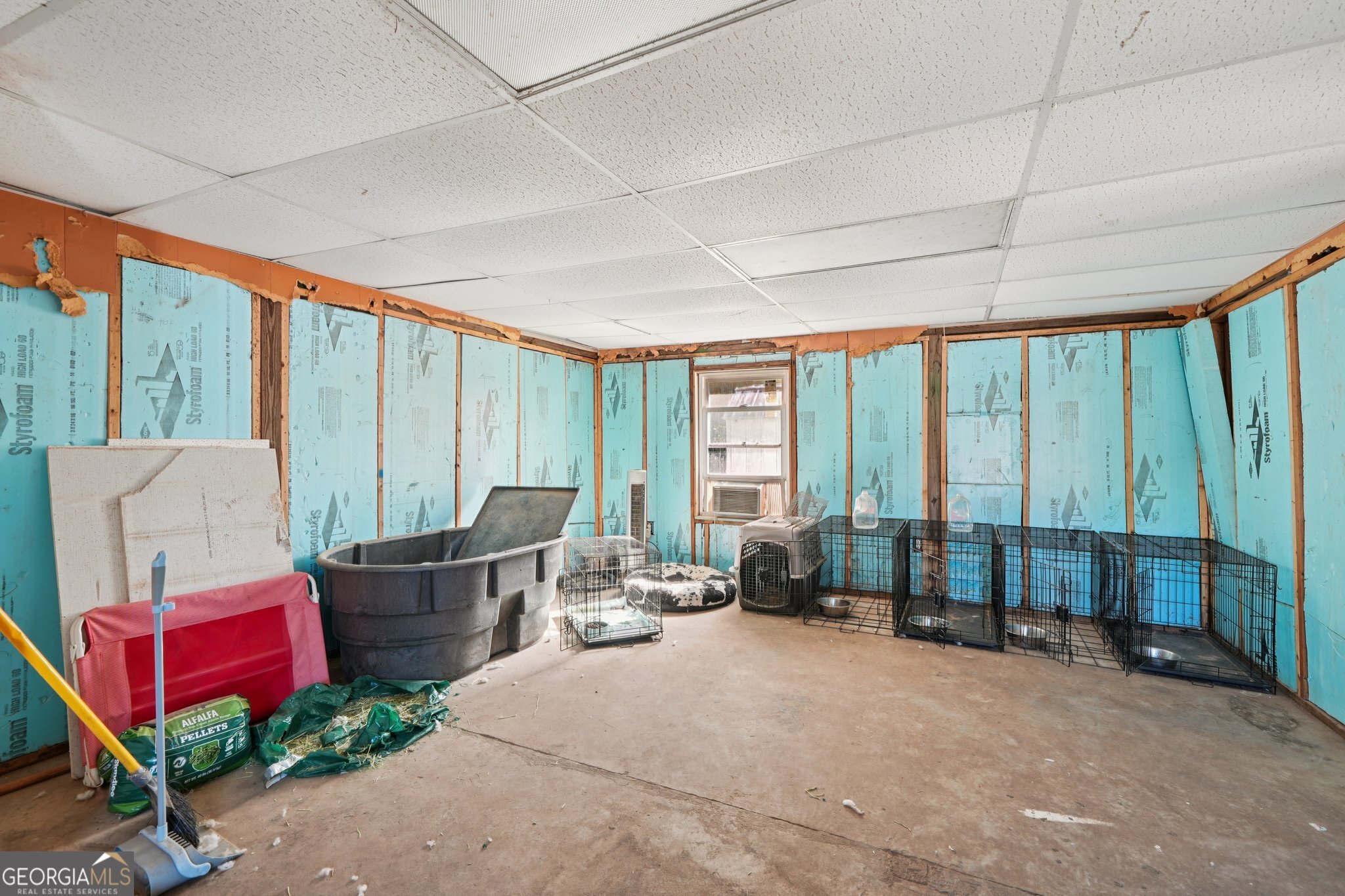 786 Moon Road Waco, GA 30182 - Photo 29 of 53 a living room with furniture and a floor to ceiling window