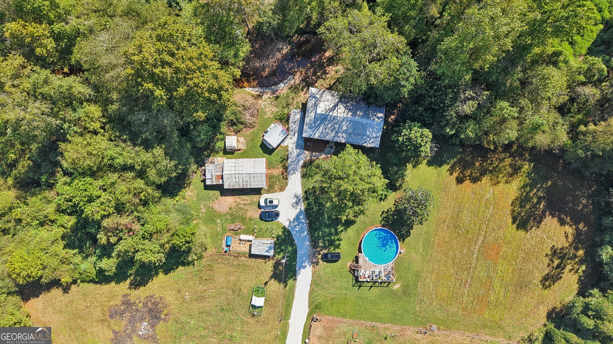 786 Moon Road Waco, GA 30182 - Photo 36 of 53 an aerial view of a swimming pool with outdoor seating and yard