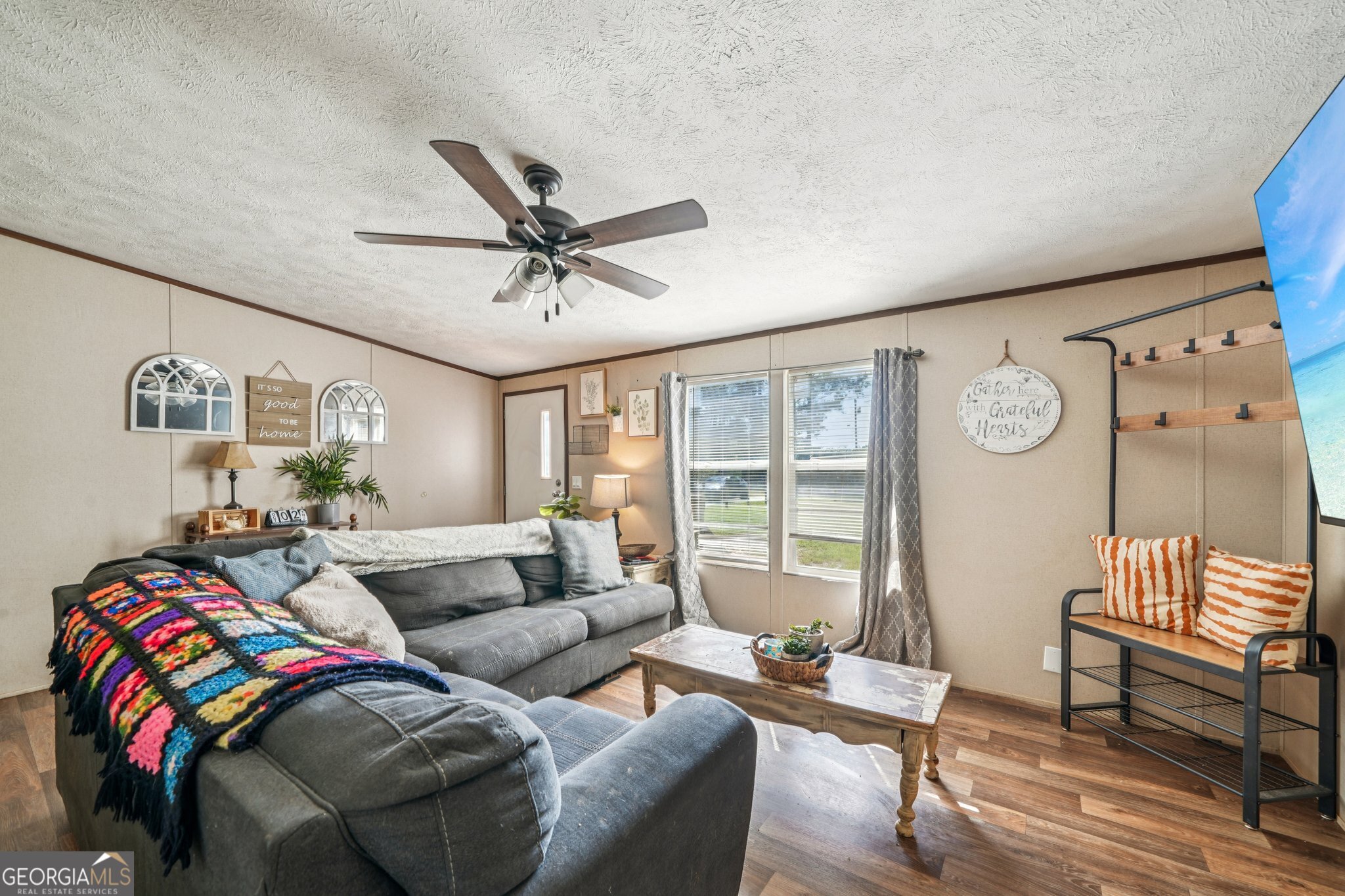 786 Moon Road Waco, GA 30182 - Photo 42 of 53 a living room with furniture a fireplace and a large window