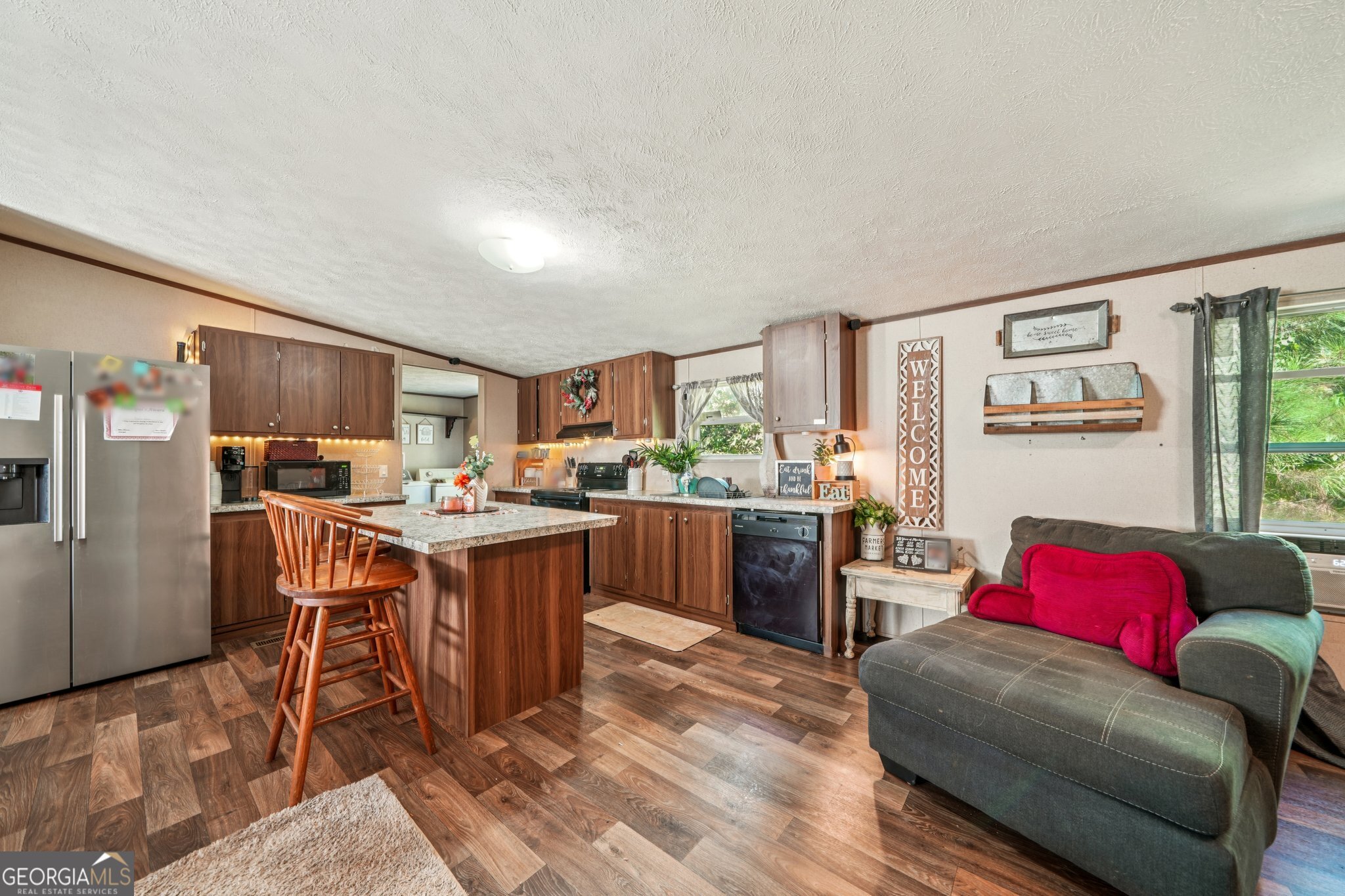 786 Moon Road Waco, GA 30182 - Photo 44 of 53 a living room with stainless steel appliances kitchen island granite countertop furniture and a kitchen view