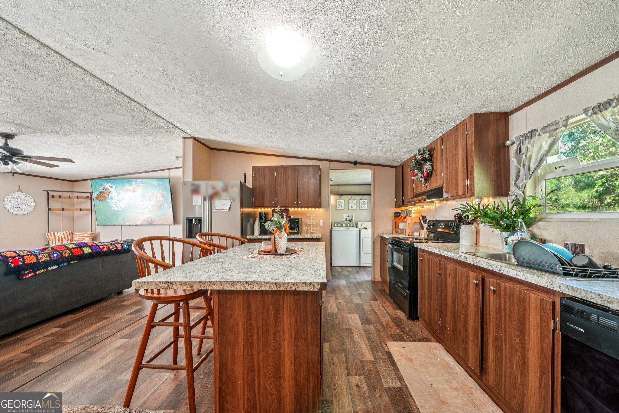 786 Moon Road Waco, GA 30182 - Photo 45 of 53 a kitchen with stainless steel appliances granite countertop sink stove top oven and cabinets