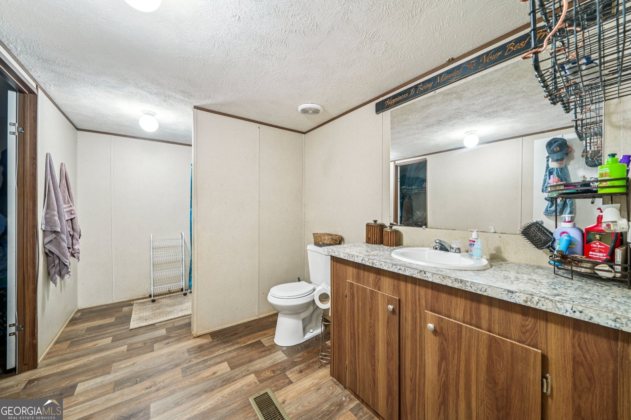 786 Moon Road Waco, GA 30182 - Photo 46 of 53 a bathroom with a granite countertop sink toilet and shower
