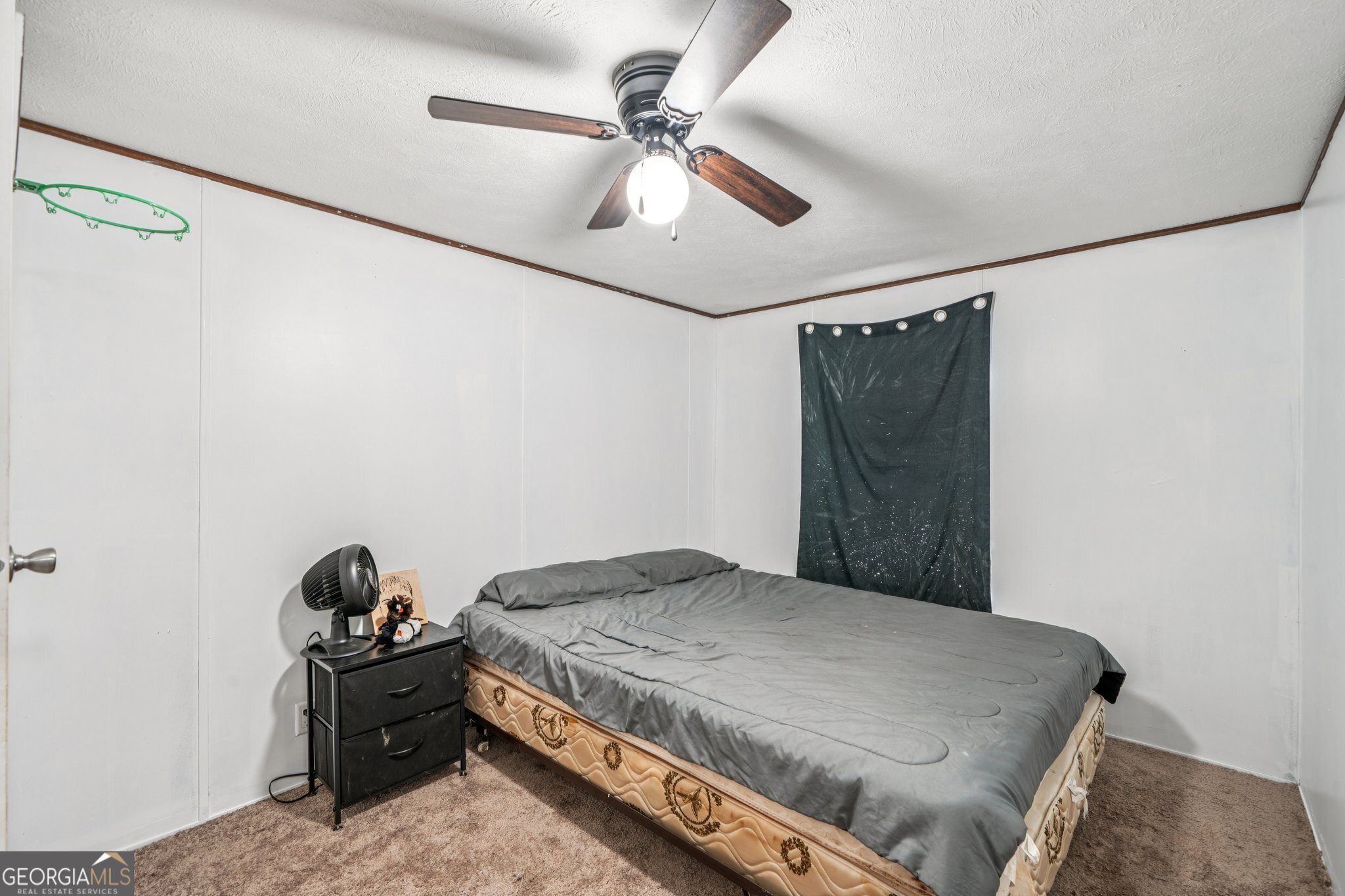 786 Moon Road Waco, GA 30182 - Photo 49 of 53 a bedroom with a bed and a ceiling fan