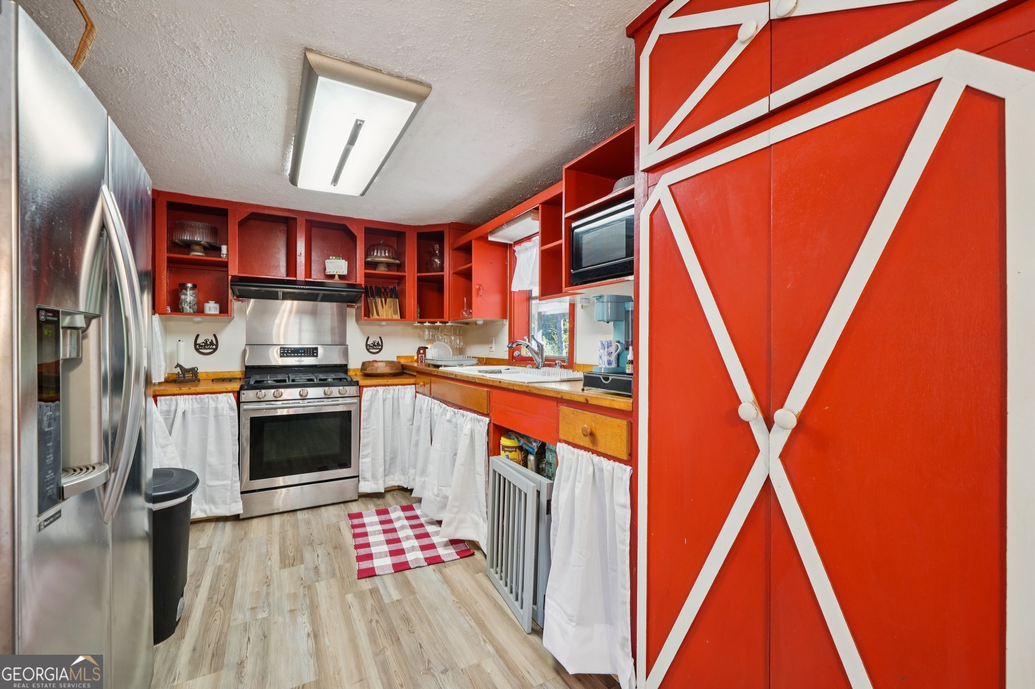 786 Moon Road Waco, GA 30182 - Photo 7 of 53 a kitchen with stainless steel appliances granite countertop a refrigerator and a sink