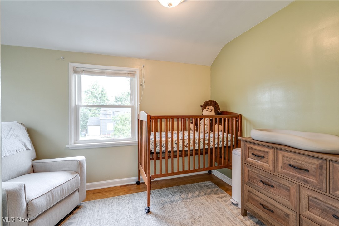 1375 Gordon Road Lyndhurst, OH 44124 - Photo 20 of 34 Bedroom featuring light wood-style floors and lofted ceiling