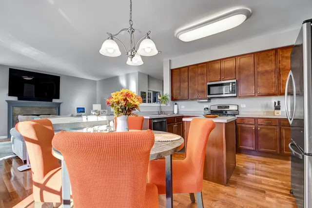 a large kitchen with a table and chairs