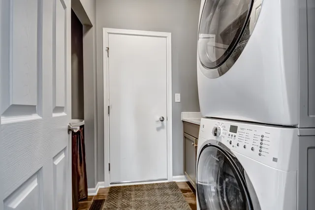 a view of a hallway with washer and dryer