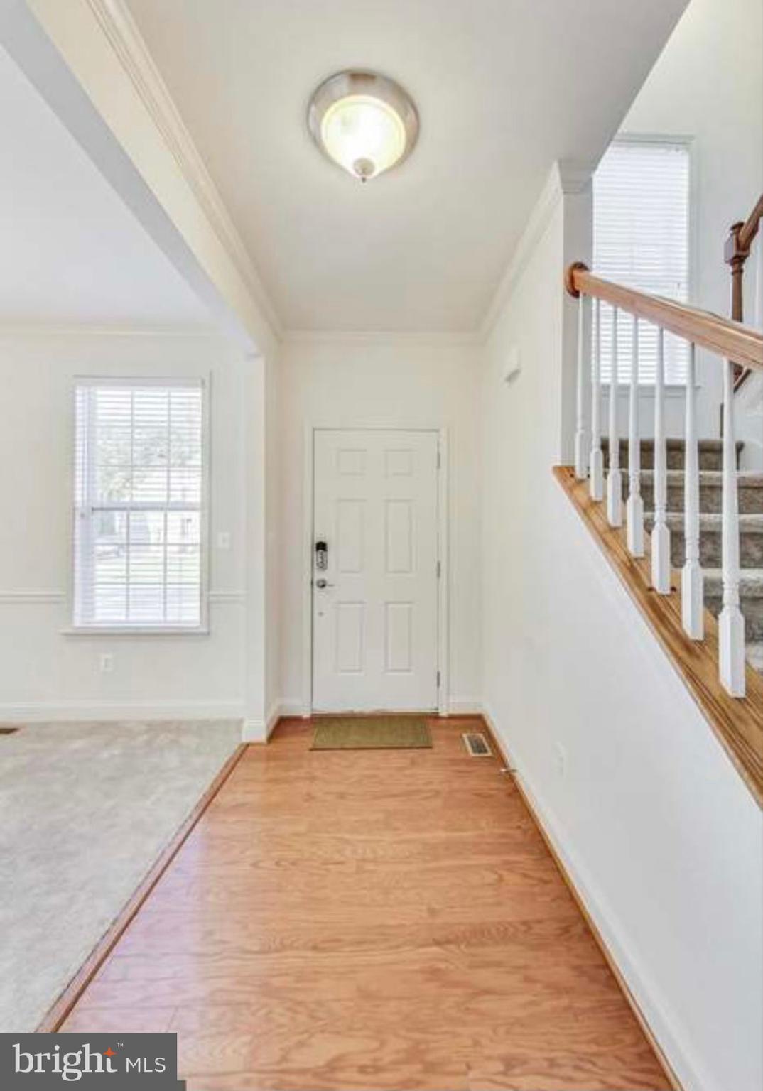 7533 Tottenham Drive White Plains, MD 20695 - Photo 3 of 51 wooden floor in an empty room with a window