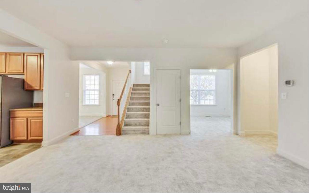 7533 Tottenham Drive White Plains, MD 20695 - Photo 4 of 51 an empty room with a kitchen and entryway