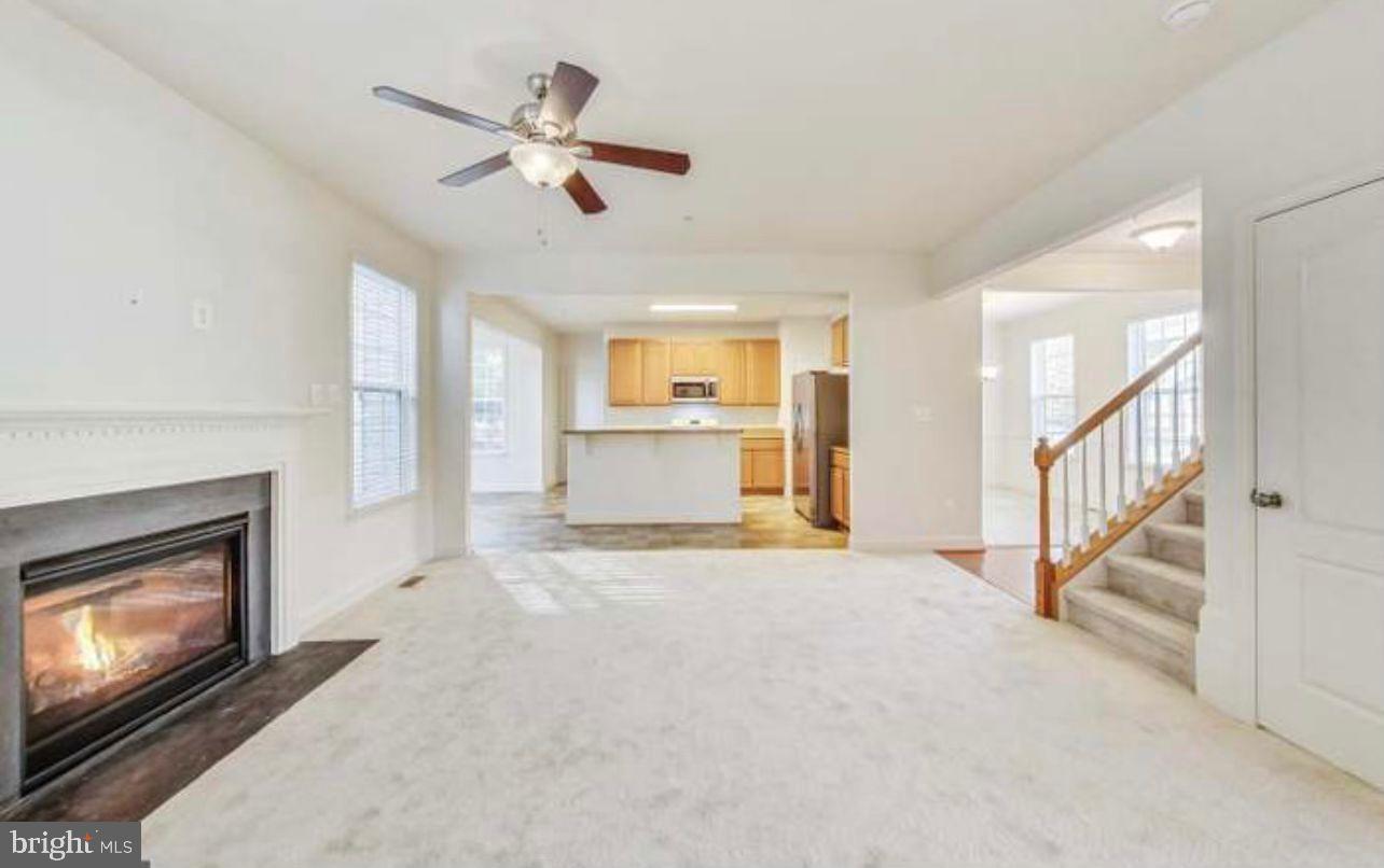 7533 Tottenham Drive White Plains, MD 20695 - Photo 5 of 51 a view of an empty room with a fireplace and a window