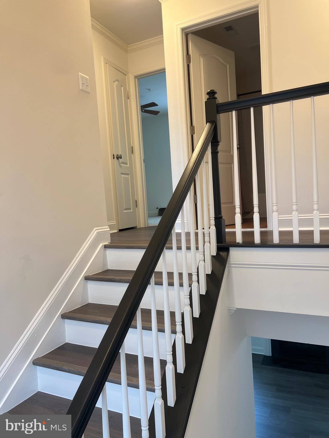 7533 Tottenham Drive White Plains, MD 20695 - Photo 51 of 51 a view of staircase with wooden floor and white walls