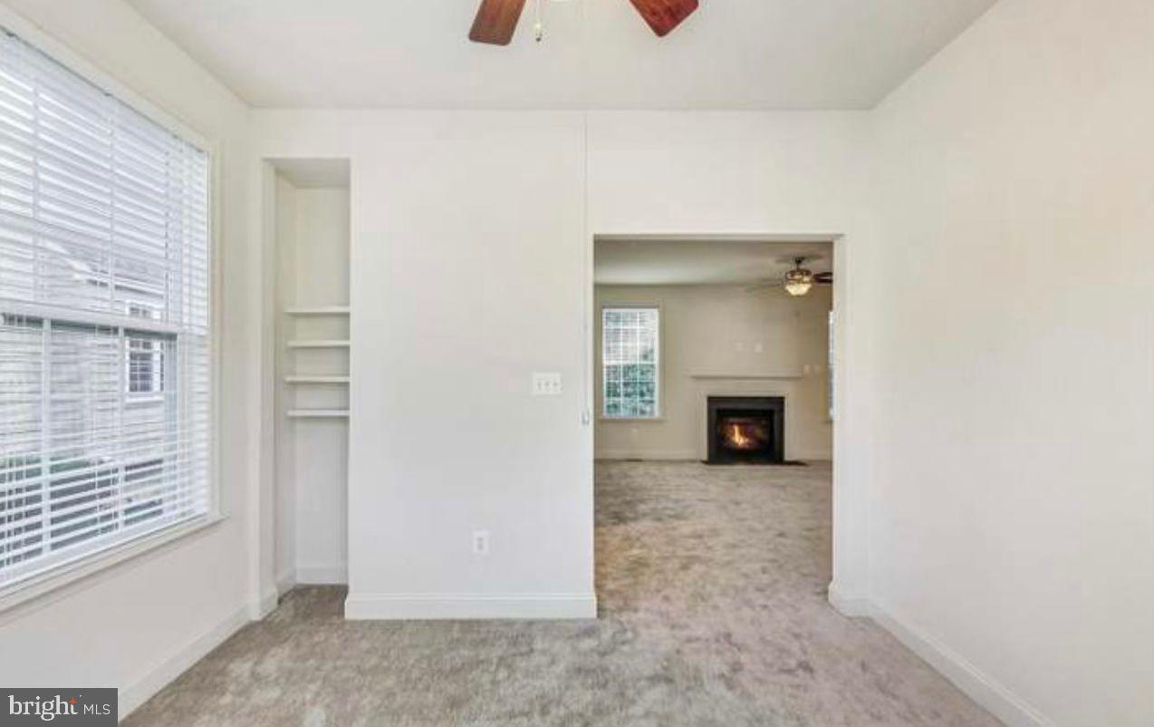 7533 Tottenham Drive White Plains, MD 20695 - Photo 8 of 51 a view of a hallway with a fireplace and a window