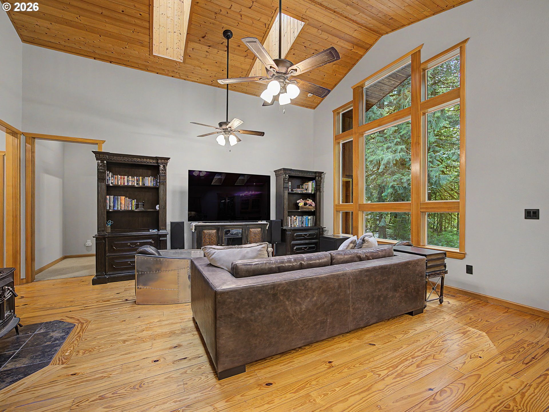 23491 East Lolo Pass Road Rhododendron, OR 97049 - Photo 12 of 47 a living room with furniture and a flat screen tv
