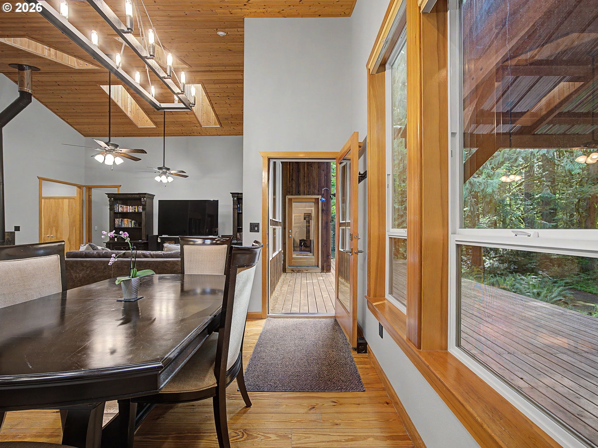 23491 East Lolo Pass Road Rhododendron, OR 97049 - Photo 17 of 47 a view of a dining room with furniture window and wooden floor