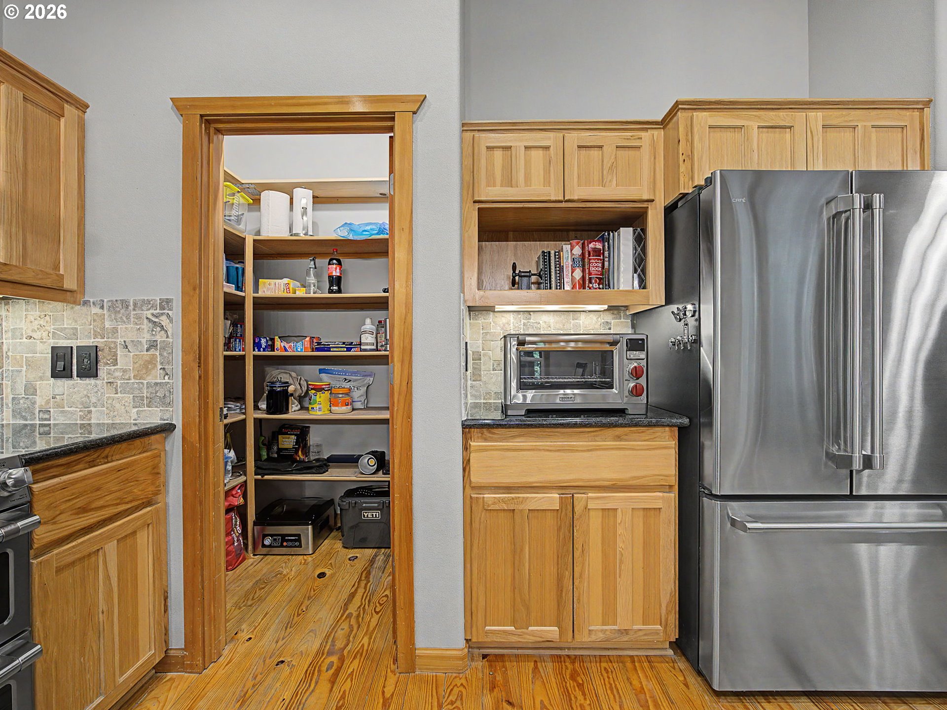 23491 East Lolo Pass Road Rhododendron, OR 97049 - Photo 20 of 47 a kitchen with stainless steel appliances a refrigerator and a cabinets