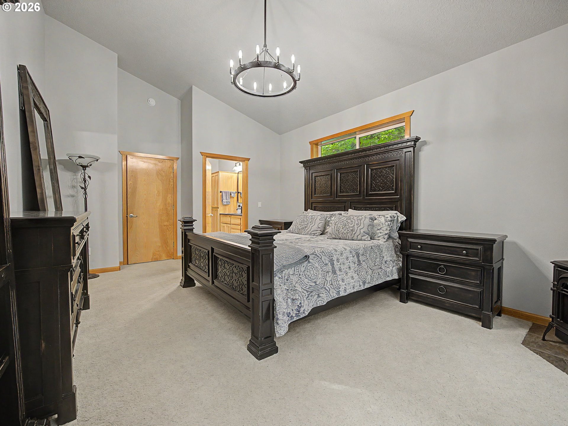 23491 East Lolo Pass Road Rhododendron, OR 97049 - Photo 21 of 47 a bedroom with a bed dresser and a window