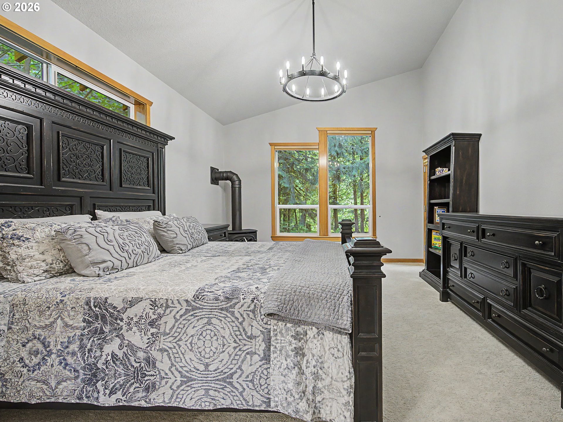 23491 East Lolo Pass Road Rhododendron, OR 97049 - Photo 23 of 47 a bedroom with a bed and wooden floor