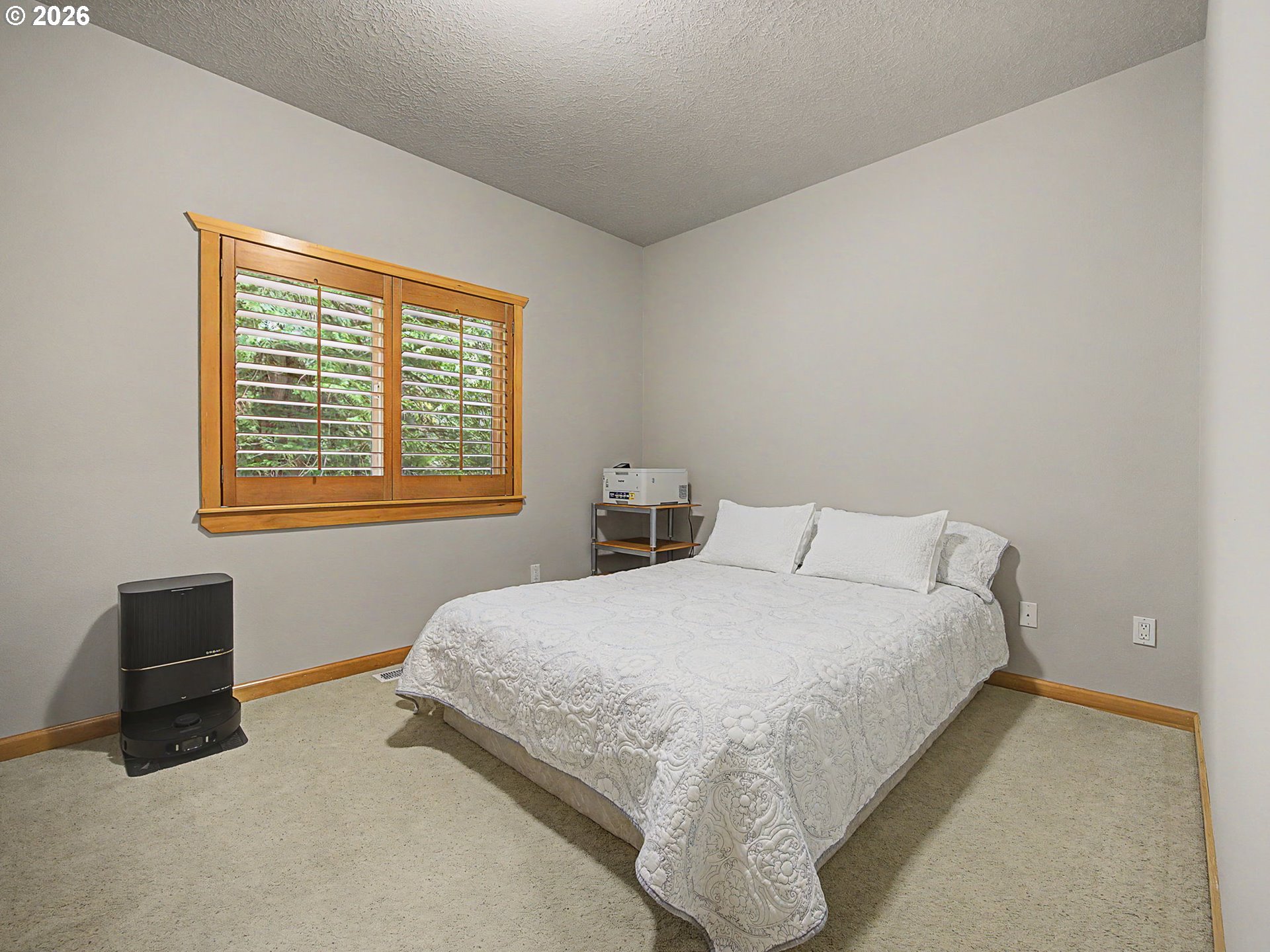 23491 East Lolo Pass Road Rhododendron, OR 97049 - Photo 29 of 47 a bedroom with a bed and two windows
